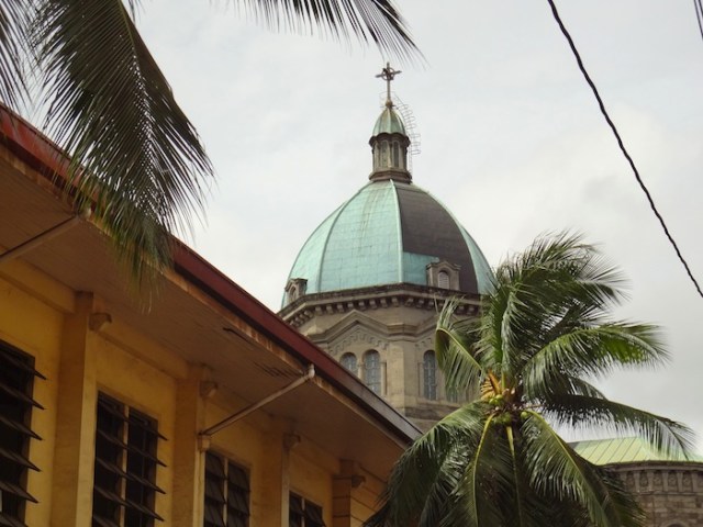 The distinctive dome of the Manila Cathedral. In the foreground, the Knights of Columbus building. 