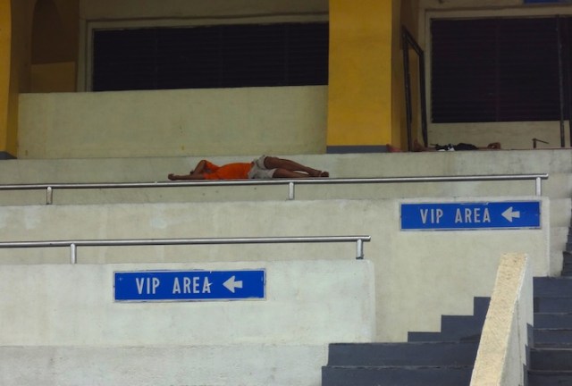 Evading the heat in the VIP Area of the Quiriño Grandstand, Rizal Park.
