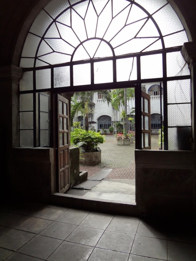 A door opens out onto the courtyard of the Church. 