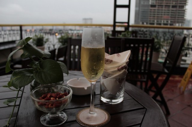 A glass of sparkling wine and a splendid view at the hotel’s rooftop bar.  