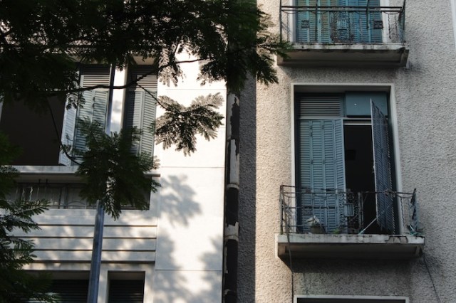 Beautiful shuttered windows of French era apartment buildings, on Dong Khoi Street.