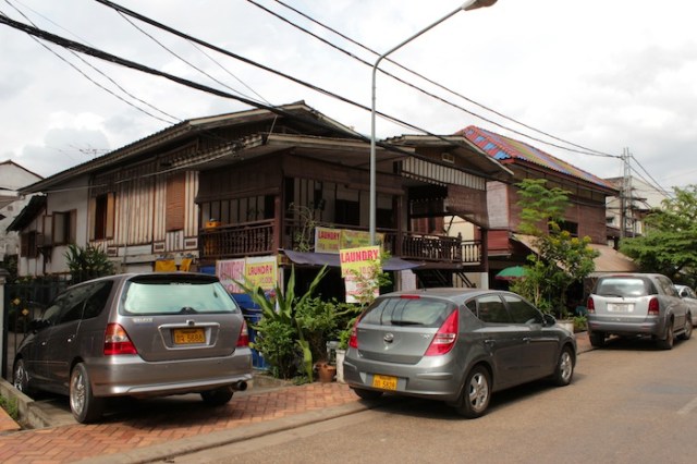 Traditional Lao wooden houses, very rare these days.  Thanon Nokeo Kumman.