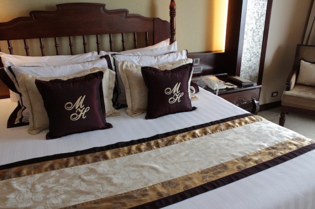 Room interior, extending the warm Filipino mahogany tones of the lobby.