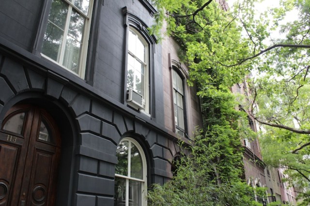 35 – No. 113: a stately black townhouse in the colonial style. 