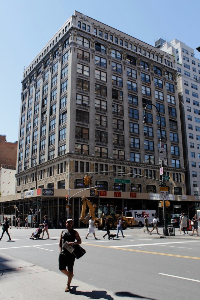 35 – 7th Ave Intersection: 1912 loft building by Herman Lee Meader, with exquisite terracotta detailing, framing a fashionable, gym-toned silhouette.