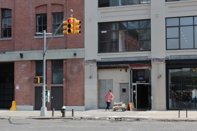 46 – Sacrificial offering to the High Priestess, in a ritual “pose.” To the left is a 3-storey warehouse dating to 1900.