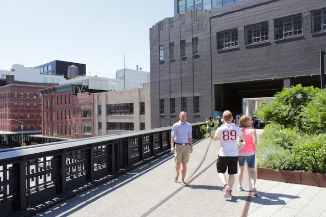 49 – Pilgrims and worshippers at the D/F Temple Complex. The sacred cartouche is visible to the left.