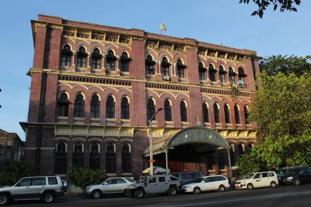 The sun sets over Bulloch Bros & Co. Building, Strand Road. It is currently a post office. 