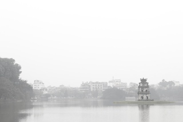 White out: Hoan Kiem Lake (Lake of the Returned Sword) shrouded in mist at dawn.