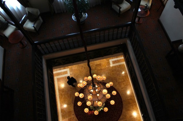 View down from the second floor to the hotel’s lobby and iconic chandlier.  