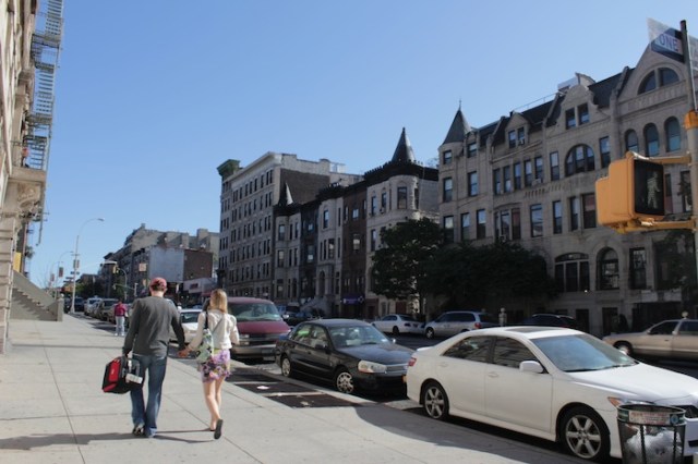 21 – White couple promenading down Edgecombe Ave. 