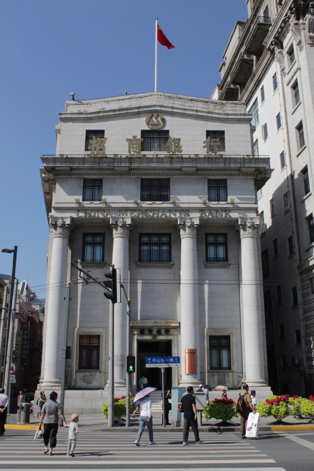 Bund #16 is the former Bank of Taiwan, designed by Lester Johnson & Morris in an eclectic style and opened in 1926.  The Bank of Taiwan was a Japanese bank because Taiwan was a Japanese colony at the time. 