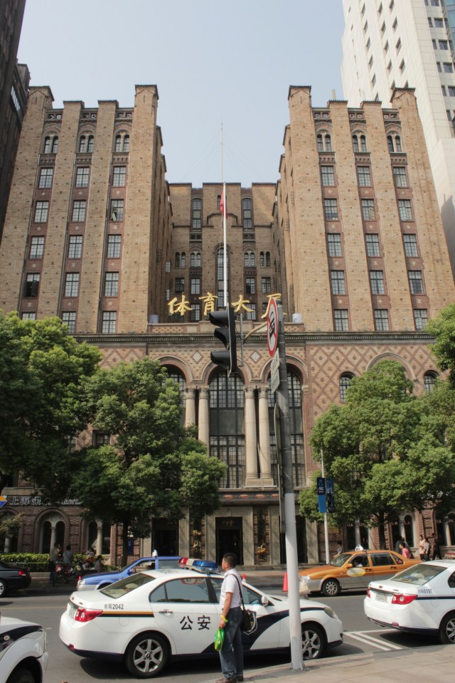 Next door sits the Foreign YMCA, designed by Elliott Hazzard in a Beaux-Arts style and opened in 1926. It houses the Shanghai Sports Club today.  