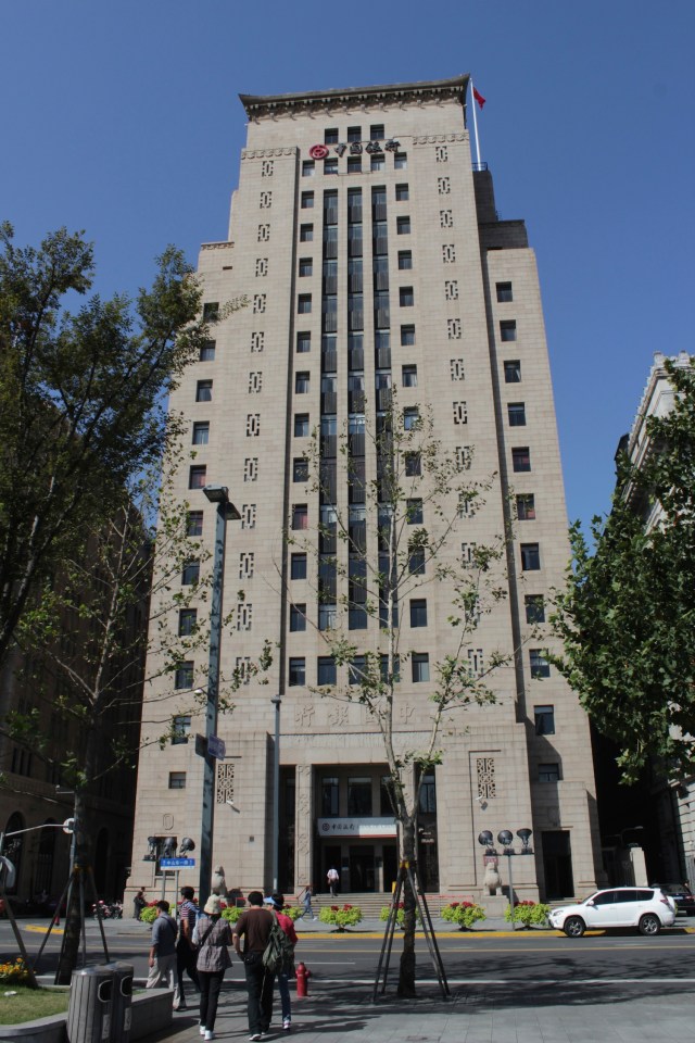 Bund #23 is the Bank of China Building, designed by Lu Qianshou of Palmer & Turner in a Chinese Nationalist style and opened in 1941. 