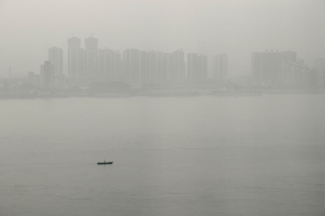 A lone boat on the river in the early morning. 孤舟簑笠翁。。。