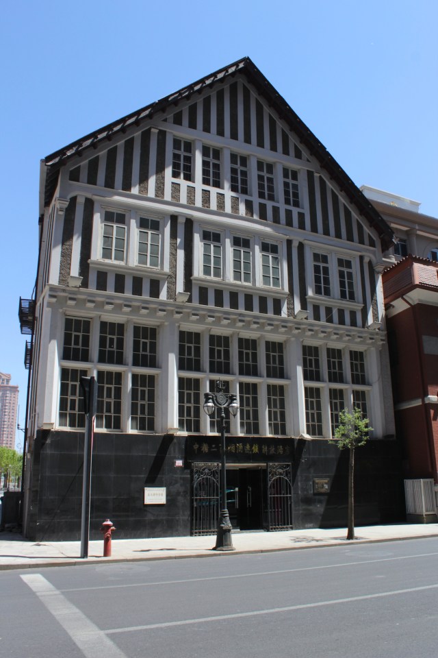 Mediaeval style building flanking Victoria Park. 