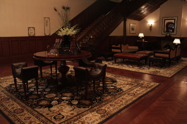 The former lobby space, looking like the living room of a large, Victorian hunting lodge (minus the trophies).