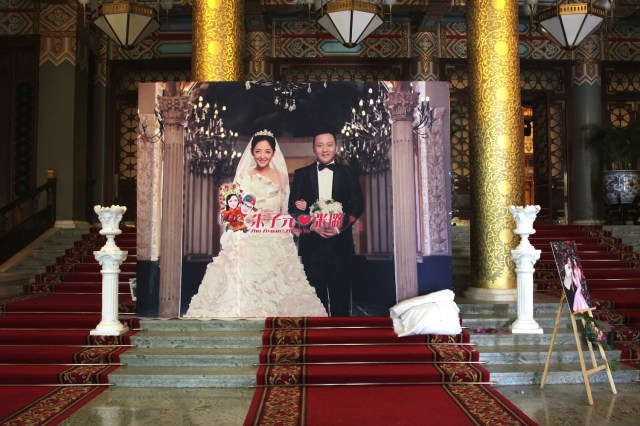 The over-the-top wedding banquet taking place within the hotel.