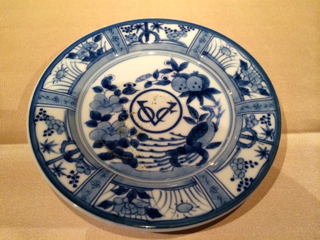 The logo of the Dutch East India Company, on a reproduction trade ceramic plate.  