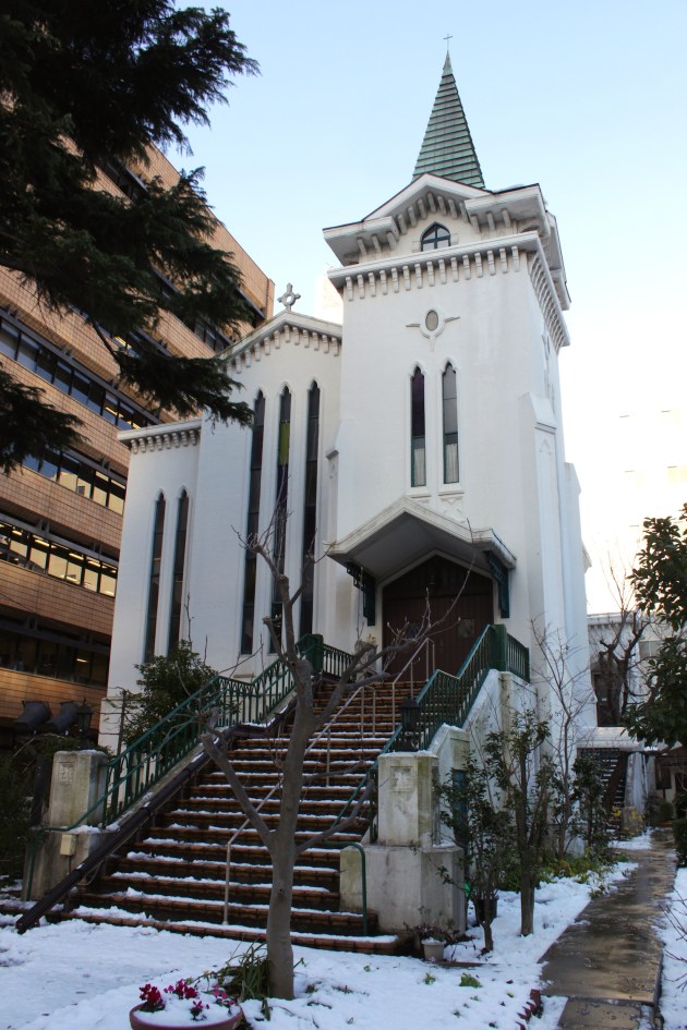 The Yokohama Kaigan Church (1933) is situated adjacent to the former British Consulate.