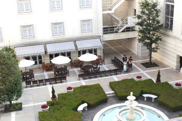 View of the Central Courtyard, and a family gathered for a wedding.