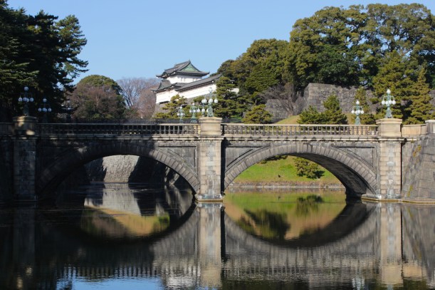 The Nijubashi 二重橋 is actually two bridges - the 正門石橋 (Seimon Ishibashi), or "Main Entrance Stone Bridge" which one sees here, is the first bridge.  
